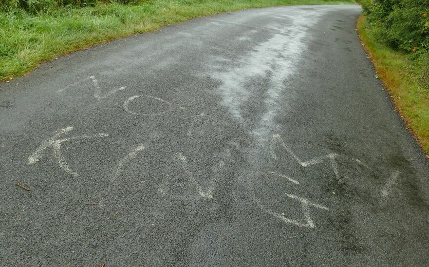 Road painted with the slogan 'not my king'